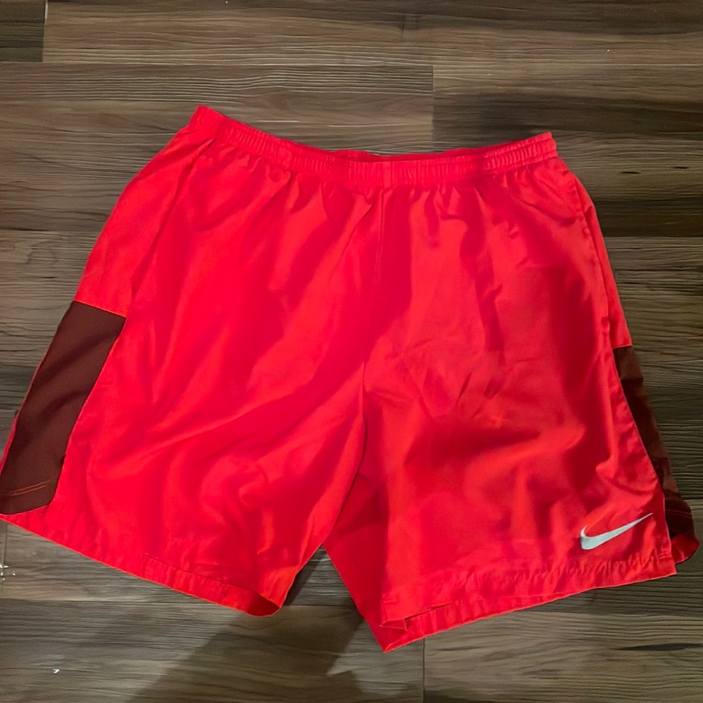 Red Nike athletic shorts